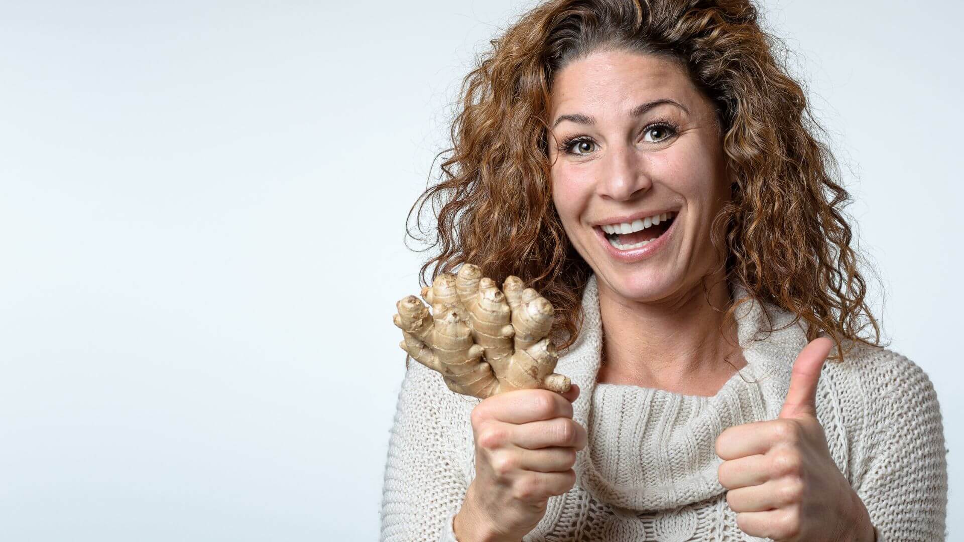 an image of a woman happy with ginger roots